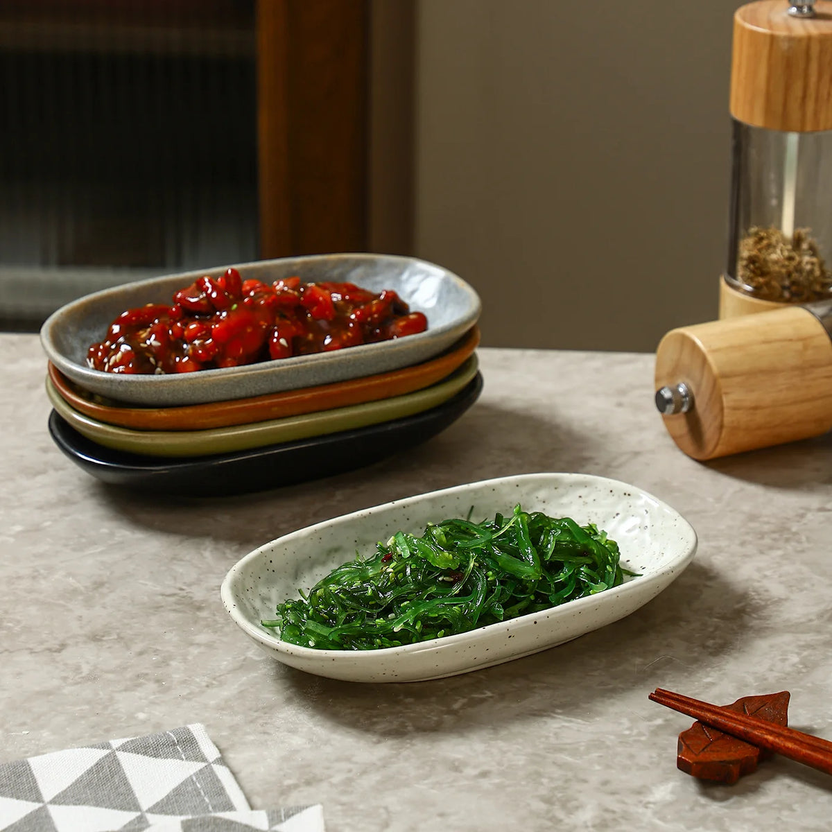 Fleck spotted oval ceramic plate